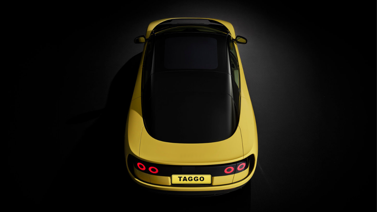 The TAGGO car, shot from above, emerging from darkness